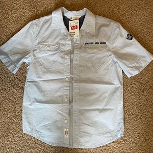 kids short sleeve light blue button up with embroidered lettering.